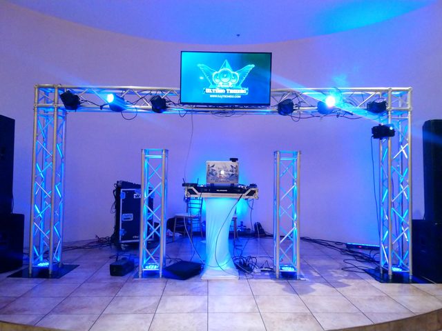 Blue truss arch and lighting rig set up before guests arrive