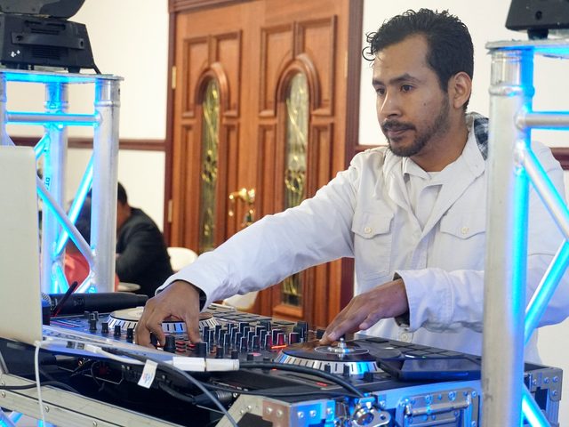 Hands on the mixer during a quinceañera celebration